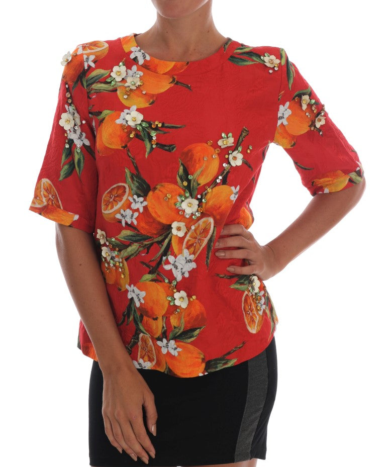 Blusa con estampado naranja y cristales de Dolce &amp; Gabbana
