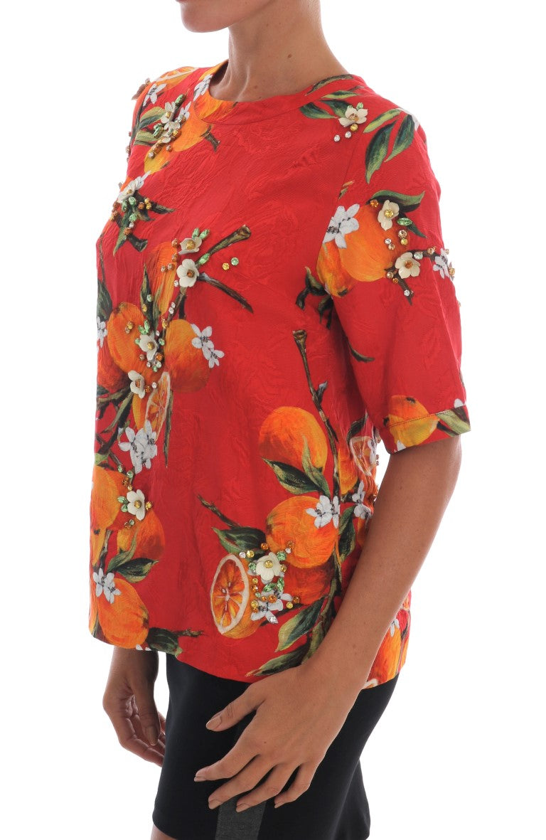 Blusa con estampado naranja y cristales de Dolce &amp; Gabbana