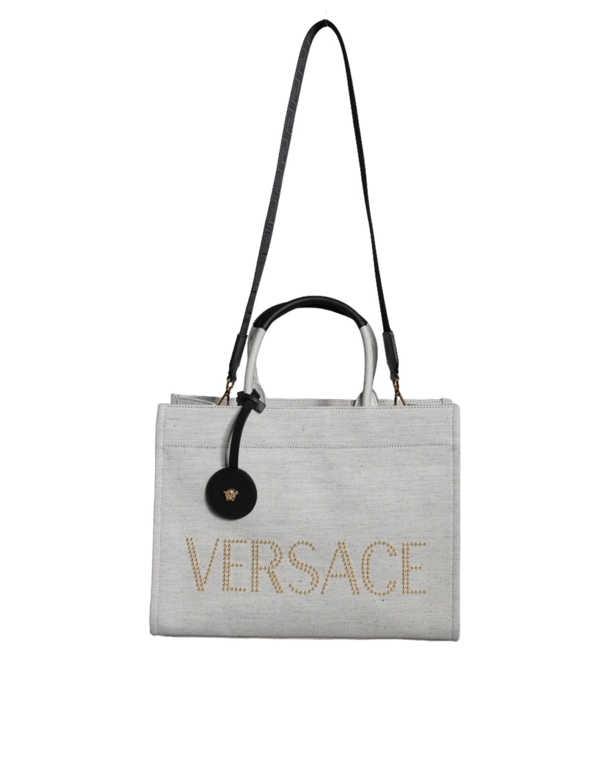 Bolso tote cruzado Versace de lona blanca con asa superior y logotipo de cuero