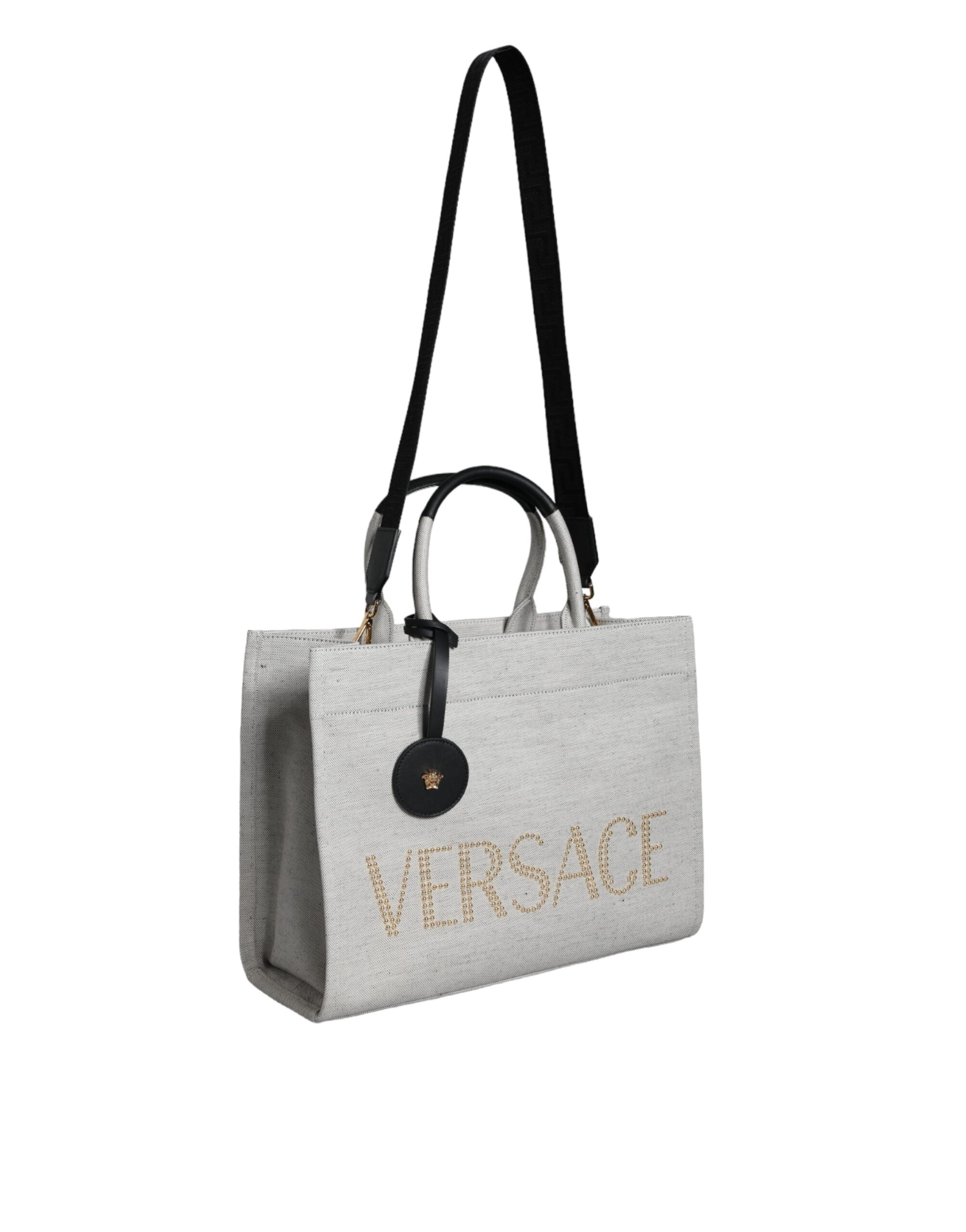Bolso tote cruzado Versace de lona blanca con asa superior y logotipo de cuero